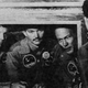 The first astronauts on the Moon sit in isolation while talking to President Richard Nixon